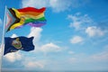 large Inter Progress Pride flag and flag of Kansas state, USA waving at sky. Freedom and love, activism, community concept. Pride