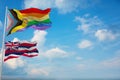 large Inter Progress Pride flag and flag of Hawaii state, USA waving at sky. Freedom and love, activism, community concept. Pride