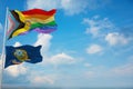 large Inter Progress Pride flag and flag of Idaho state, USA waving at sky. Freedom and love, activism, community concept. Pride