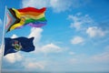 large Inter Progress Pride flag and flag of Maine state, USA waving at sky. Freedom and love, activism, community concept. Pride