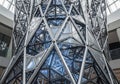 A large, intricate structure composed of triangular metal frames and transparent panels with Royalty Free Stock Photo