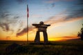 An Inukshuk in a prairie sunset Royalty Free Stock Photo