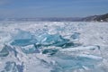 Large iridescent crystals white blue ice floes with cracks glow in the light of the sun, lake baikal, mountain Royalty Free Stock Photo