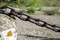 Large iron anchor chain on shore Royalty Free Stock Photo