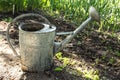 Large iron watering can, watering plants Royalty Free Stock Photo