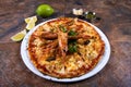 Large Italian Seafood Pizza served with king prawns Royalty Free Stock Photo