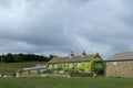 Large ivy covered countryside farmhouse