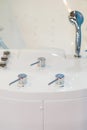 Large Jacuzzi bath for spa procedures in salon or in interior of house. Clean bathroom modern bath , bathroom white hygiene clean Royalty Free Stock Photo