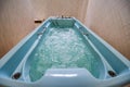 View of modern Jacuzzi bath filled with water turned on Royalty Free Stock Photo