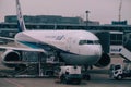Large jet airliner parked at the terminal awaiting passengers to board in Narita, Japan Royalty Free Stock Photo