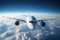 A large jetliner flying through a blue cloudy sky Royalty Free Stock Photo