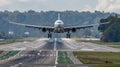 A large jetliner taking off from an airport runway at noon Royalty Free Stock Photo