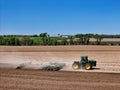 Large John Deere tractor pulling a John Deere disk cultivator Royalty Free Stock Photo