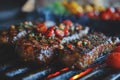 Large juicy beef rib eye steak on a hot grill