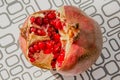 Large juicy open pomegranate on the table