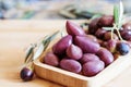 Olives on wooden background, kalamata, kalamon, green olives