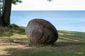 Large kettle rock on grass at Kettle Point Park, Ontario, Canada. Royalty Free Stock Photo