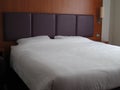 Large kingsize double bed closeup. Royalty Free Stock Photo