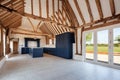 Large kitchen with vaulted ceiling and numerous exposed beams