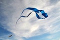 A large kite of blue color, made of silk, and a little multicolored