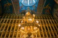 Large lamp with candles in the cathedral