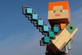 Large Lego Minecraft figure of Alex with diamond sword.