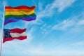 large lgbt flag and flag of the Confederate States of America July November 1861 state, USA waving in sky. Freedom and love