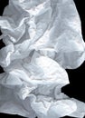 Large light elegant cloud of crumpled paper on a black background. White and gray wide crumpled paper texture background. Crushed