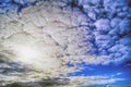 Large light gray clouds swirling against the blue sky Royalty Free Stock Photo