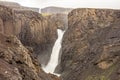 Large Litlanesfoss waterfall in Iceland with its basaltic landscape