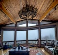 Large living room space in log cabint in the mountains with a view