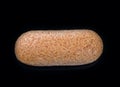 Large loaf of bread isolated on black