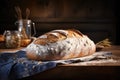 a large loaf of bread is sitting on a wooden board