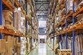 Large Logistics hangar warehouse with lots shelves or racks with pallets of goods. Industrial shipping Royalty Free Stock Photo