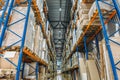 Large Logistics hangar warehouse with lots shelves or racks with pallets of goods. Industrial shipping and cargo delivery Royalty Free Stock Photo