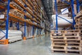 Large Logistics hangar warehouse with lots shelves or racks with pallets of goods. Industrial shipping and cargo delivery Royalty Free Stock Photo