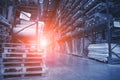 Large Logistics hangar warehouse with lots shelves or racks with pallets of goods. Industrial shipping and cargo delivery, toned Royalty Free Stock Photo