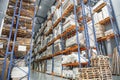 Large Logistics hangar warehouse with lots shelves or racks with pallets of goods and sunlight effect. Industrial shipping Royalty Free Stock Photo