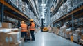 Large logistics warehouse interior with workers in safety vests Royalty Free Stock Photo