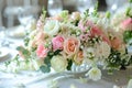 A large, long, decorated table , covered with a white tablecloth with dishes, flowers. Wedding banquet. close up Royalty Free Stock Photo