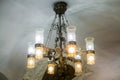 Large luxurious chandelier under the ornamental arched ceiling.