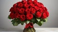 large luxury bouquet of fresh red roses in a glass vase on grey background, banner, copy space Royalty Free Stock Photo