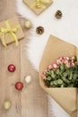 Large luxury bouquet of roses, Christmas balls and gifts on a fur carpet Royalty Free Stock Photo