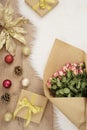 Large luxury bouquet of roses, Christmas balls and gifts on a fur carpet. Winter holidays concept Royalty Free Stock Photo