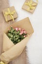 Large luxury bouquet of roses and gifts on a fur carpet Royalty Free Stock Photo