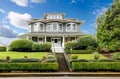 Large luxury green craftsman classic American house exterior. Royalty Free Stock Photo