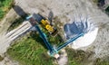 Large machine for screening sand and bulldozer, vertical aerial Royalty Free Stock Photo