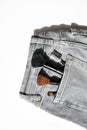 Large makeup brushes in pocket of gray jeans. Concept, commercial work of a makeup artist, for printing business cards and Royalty Free Stock Photo