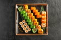 Large maki sushi set with a varied assortment of Japanese rolls in a square plate Royalty Free Stock Photo