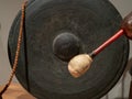 Mallet prepares to strike an ancient Asian gong